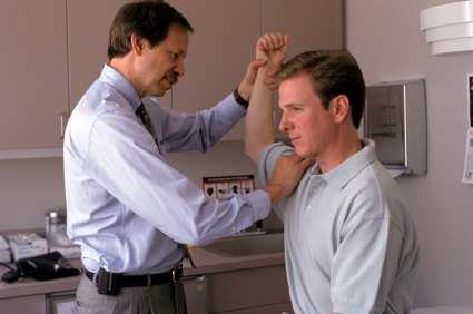 Doctor examining a patient's elbow.